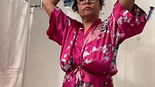 Anna, the mature Latina, sways seductively in her robe, teasing with every move.